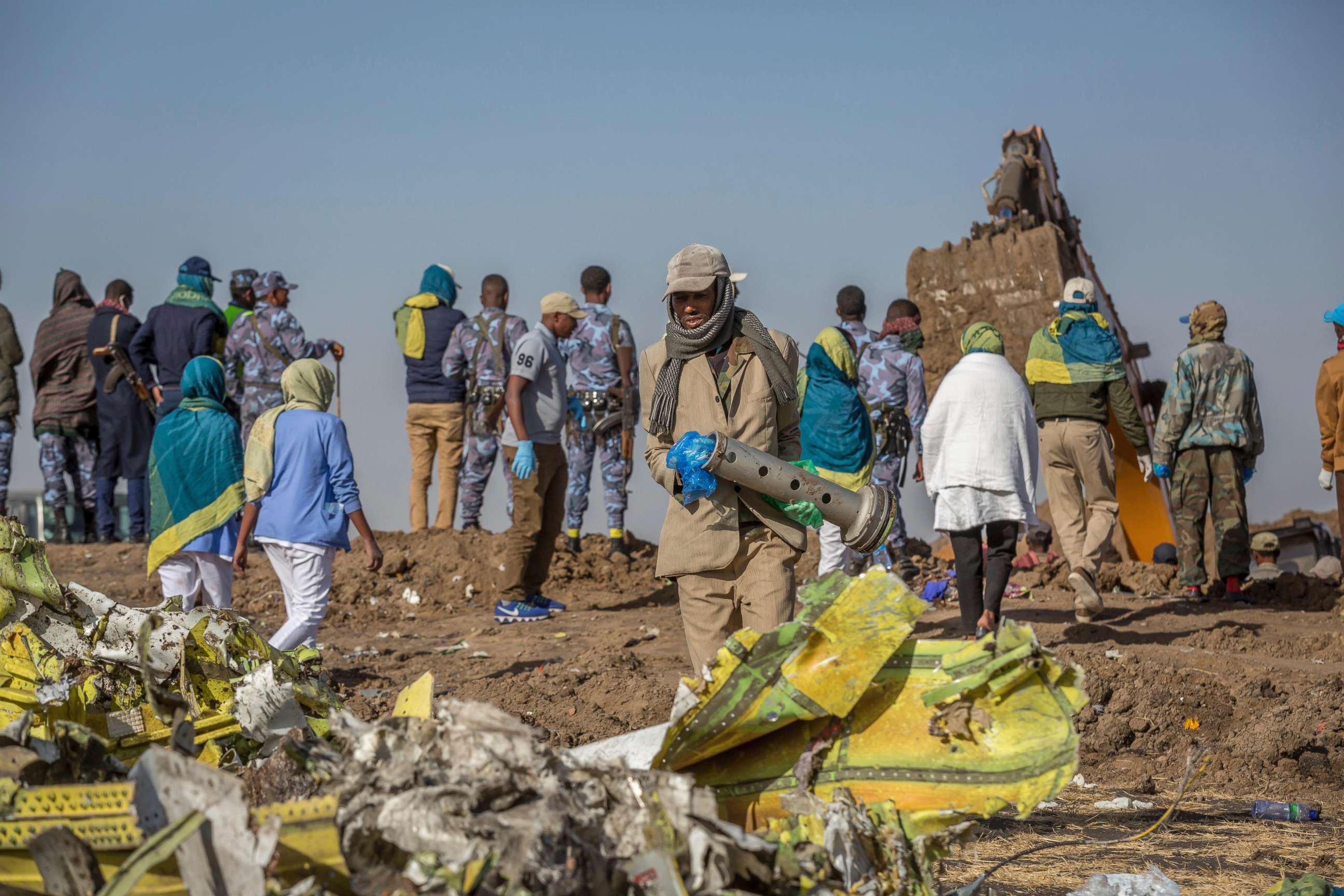 PHOTO: Workers gather at the scene of an Ethiopian Airlines flight crash near Bishoftu, south of Addis Ababa, Ethiopia, March 11, 2019.