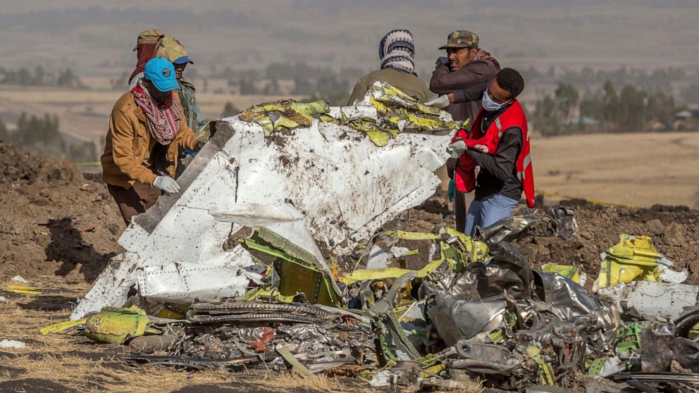 PHOTO: In this March 11, 2019, rescuers work at the scene of an Ethiopian Airlines flight crash near Bishoftu, or Debre Zeit, south of Addis Ababa, Ethiopia.