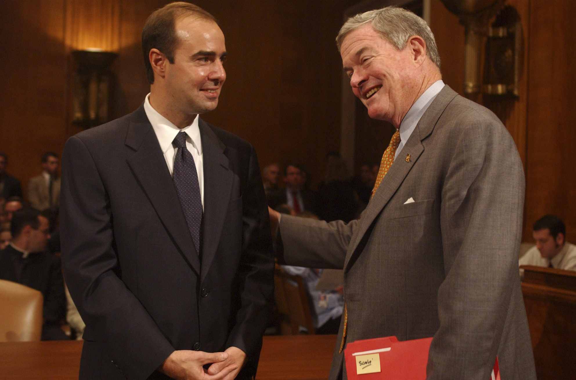 PHOTO: Eugene Scalia, left, nominee for Solicitor of Labor, gets encouragement from Sen. Kit Bond, before a conformation hearing, Oct. 2, 2001, in Washington, DC.