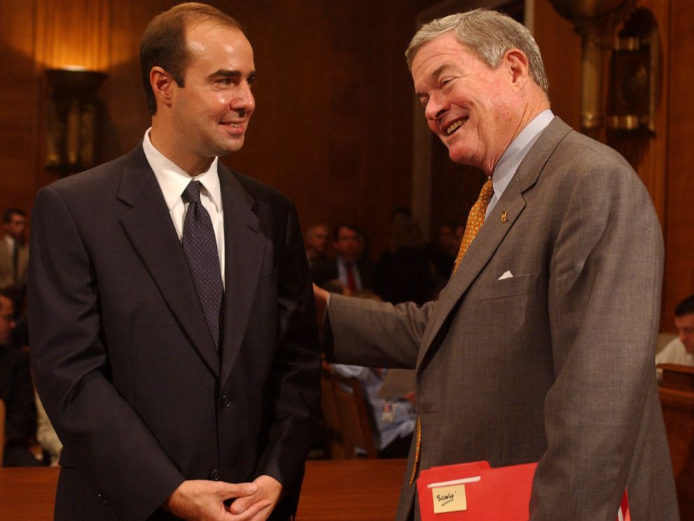 PHOTO: Eugene Scalia, left, nominee for Solicitor of Labor, gets encouragement from Sen. Kit Bond, before a conformation hearing, Oct. 2, 2001, in Washington, DC.