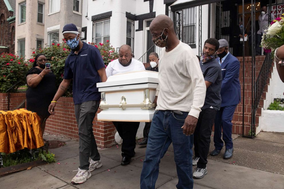 PHOTO: Pallbearers carry the casket of Evelyn Moore Smith, 68, who died with COVID-19, following a funeral service in Washington, D.C., May 28, 2020.