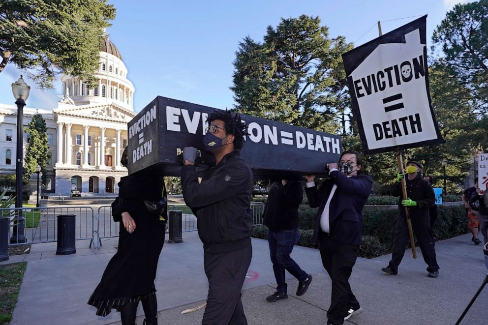 PHOTO: In this Jan. 25, 2021, file photo, demonstrators call passage of rent forgiveness and stronger eviction protections legislation and carry a mock casket past the Capitol in Sacramento, Calif.