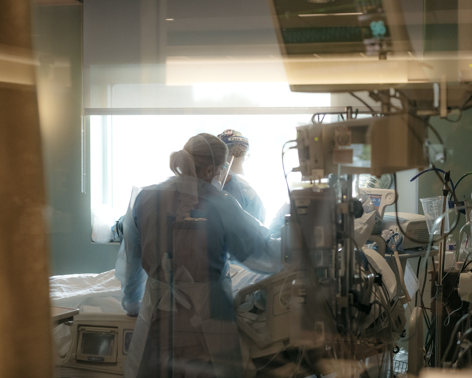 PHOTO: Nurses check on a patient in the ICU Covid-19 ward at NEA Baptist Memorial Hospital in Jonesboro, Ark., U.S., Aug. 4, 2021. 