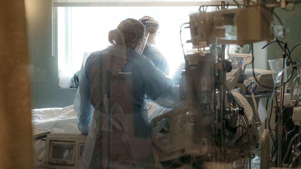 PHOTO: Nurses check on a patient in the ICU Covid-19 ward at NEA Baptist Memorial Hospital in Jonesboro, Ark., U.S., Aug. 4, 2021. 