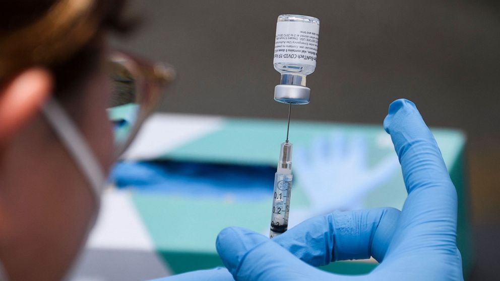 PHOTO: A syringe is filled with a dose of the Covid-19 vaccine at a mobile vaccination in Los Angeles, Aug. 7, 2021.