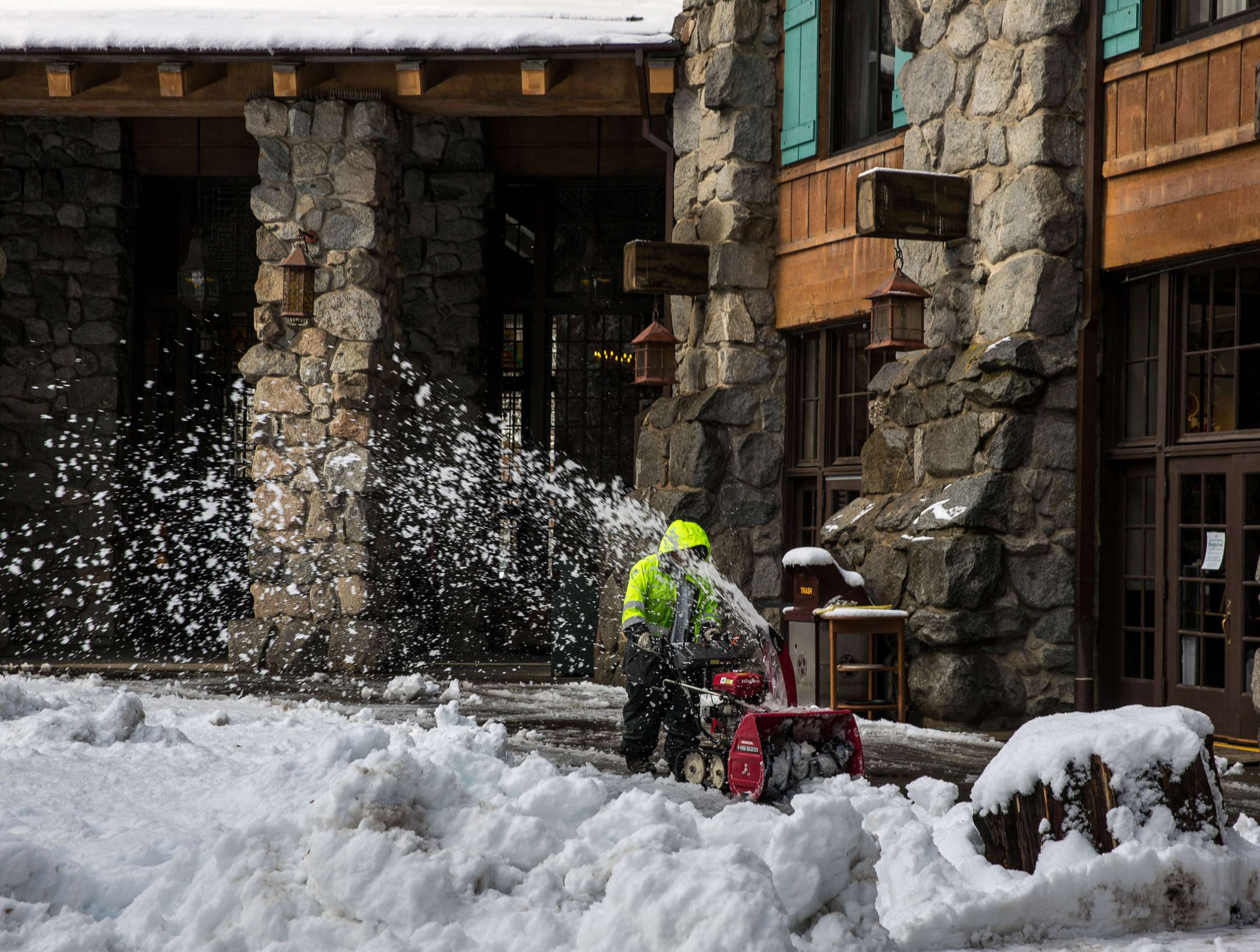PHOTO: A worker snowplows sidewalks after major Pacific storm dumps a foot of in snow in Yosemite Valley and 8-10 feet of powder in the higher elevations of the Park and along the Sierra Nevada crest in Yosemite National Park, Calif. Dec. 16, 2021.