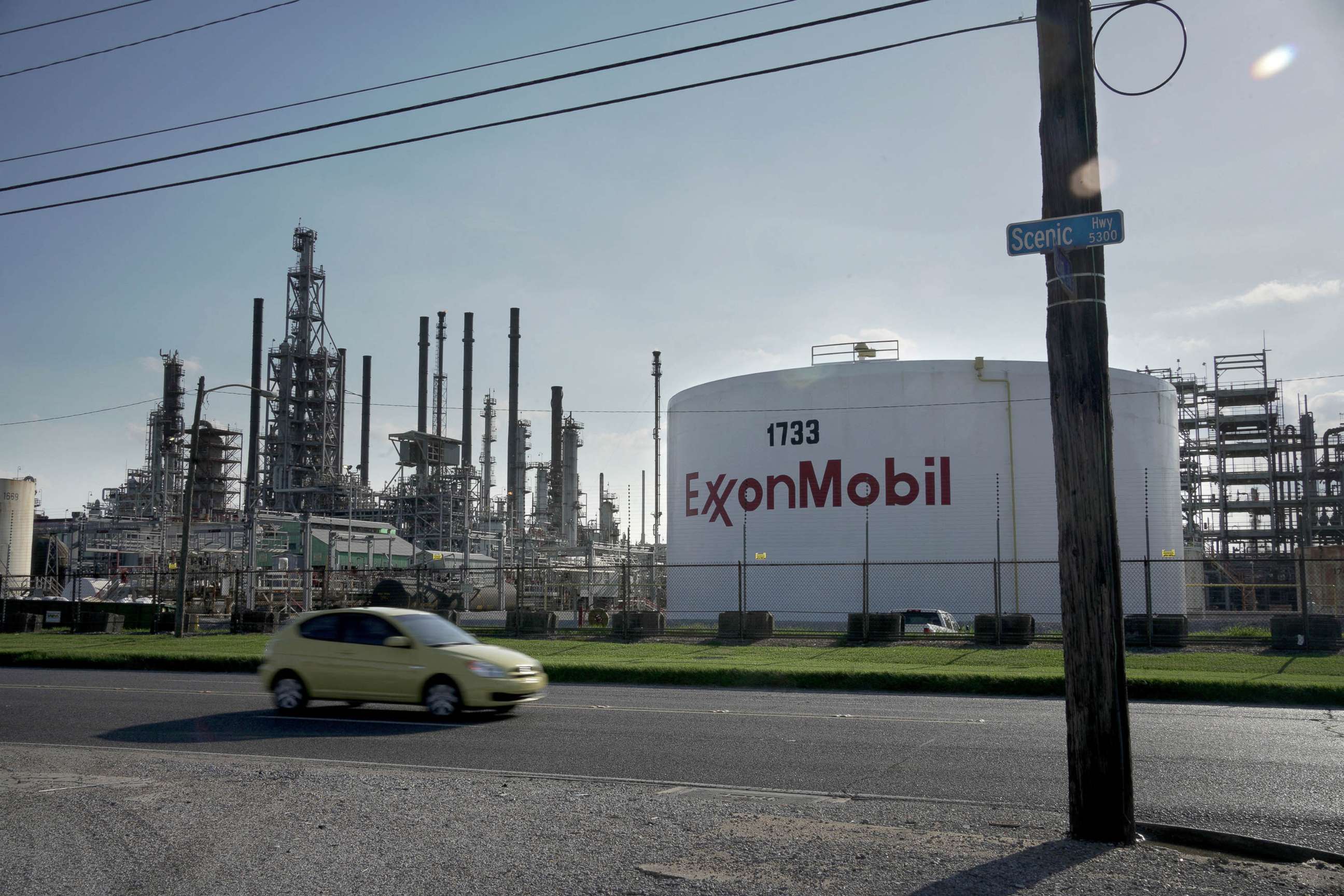 PHOTO: A car drives past the ExxonMobil Baton Rouge Refinery in Baton Rouge, La., May 15, 2021.