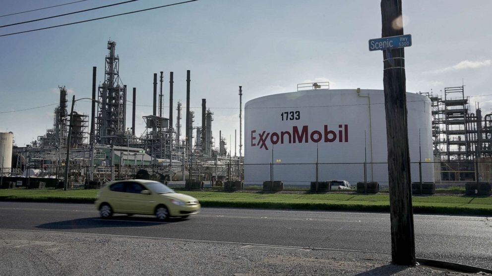 PHOTO: A car drives past the ExxonMobil Baton Rouge Refinery in Baton Rouge, La., May 15, 2021.