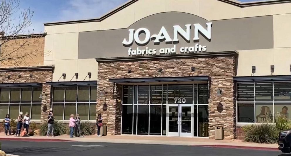 PHOTO: People line up outside a Joann's fabric and crafts store in Washington County, Utah.