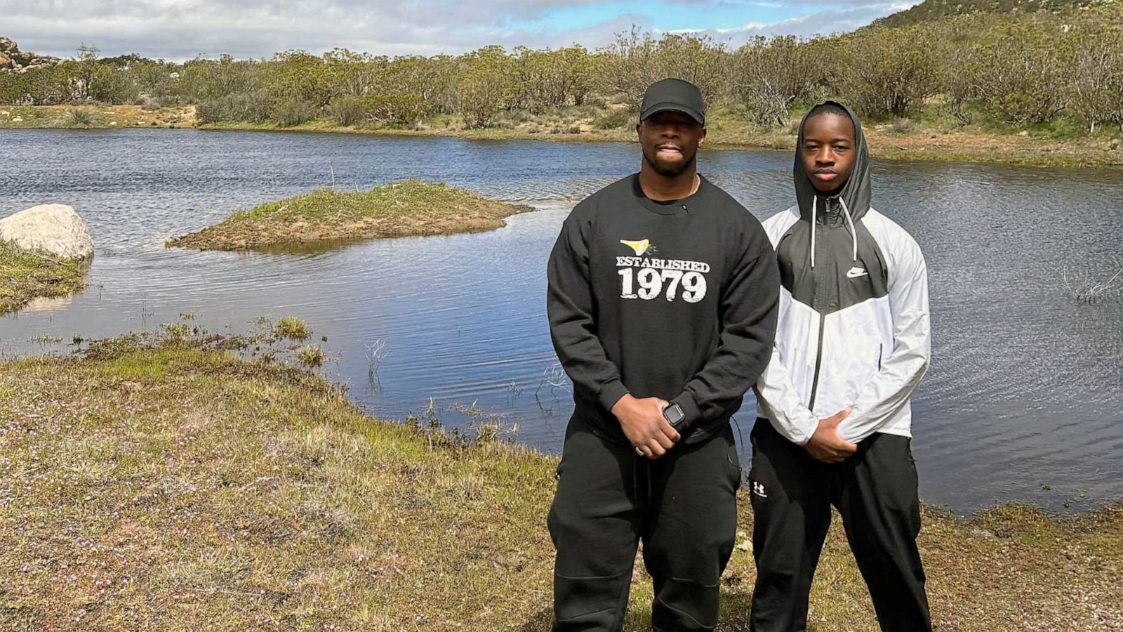 PHOTO: Faheem Muhammad and his son Faheem Ra'id Muhammad stand on the 40 acres Faheem Muhammad bought his son.