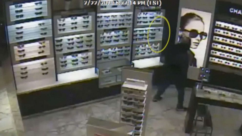 PHOTO: An image from footage released by Fairfax County police on March 23, 2023, shows Timothy Johnson in a store at the mall near a sunglasses display, Feb. 22, 2023.
