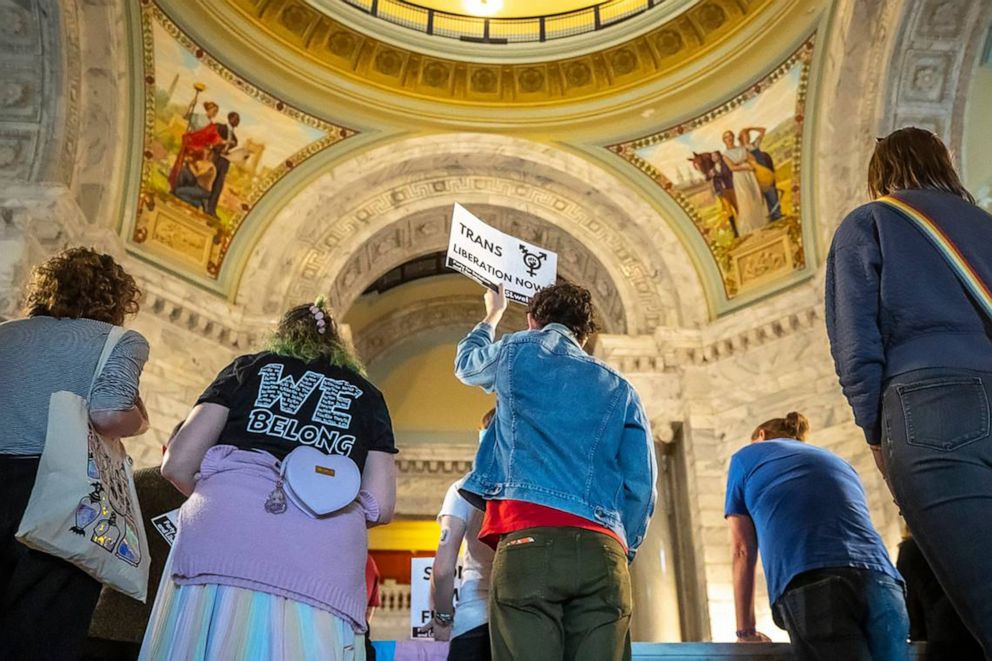 PHOTO: Christian Brawner, of Louisville, holds a Trans Liberation Now sign during the Fairness Rally at the Kentucky state Capitol, Feb. 15, 2023, in Frankfort, Ky.