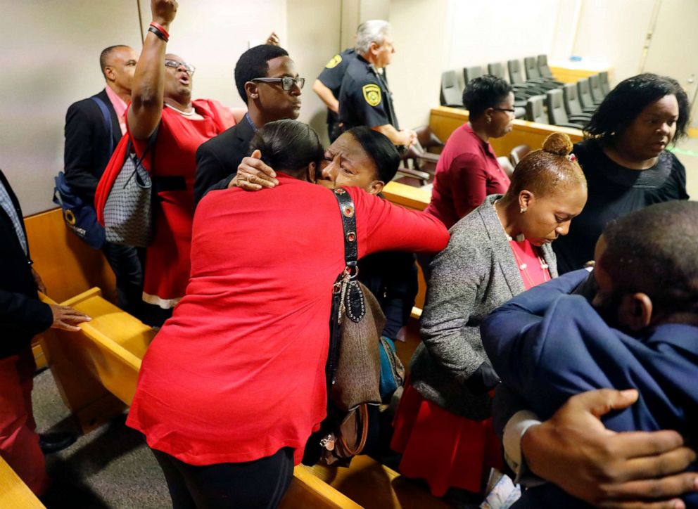 PHOTO: Members of Botham Jean's family embrace in the courtroom after fired Dallas police Officer Amber Guyger was found guilty of murder, Oct. 1, 2019, in Dallas.