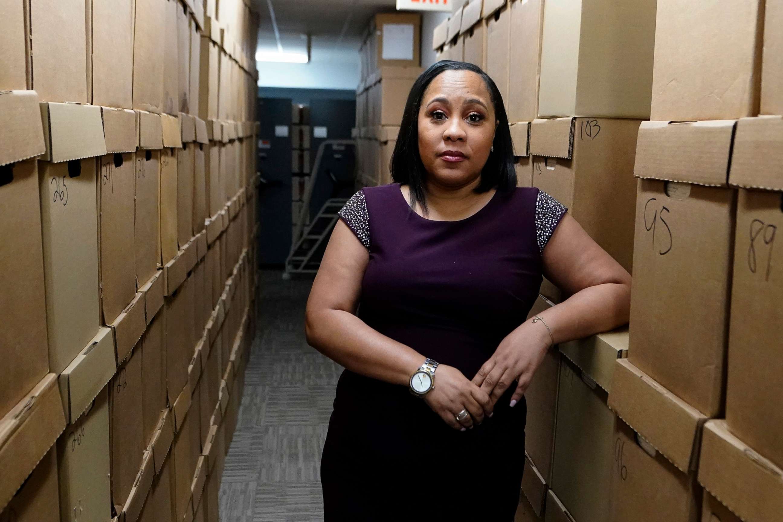 PHOTO: Fulton County District Attorney Fani Willis poses among boxes containing thousands of cases at her office, Feb. 24, 2021, in Atlanta. 