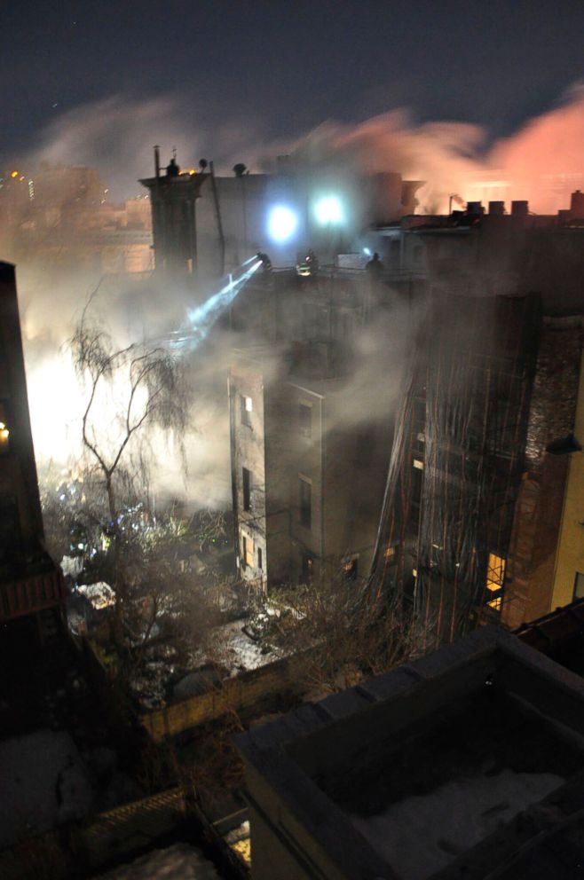 Firefighters work at the scene of a overnight fire that began on March 22, 2018, in the Harlem neighborhood of New York City. The blaze broke out in the basement of a former Harlem jazz club, used as a film set for "Motherless Brooklyn."