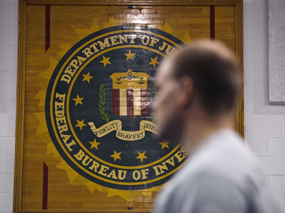 hollywood PHOTO: A new agent trainee walks by the FBI seal on a wall at the FBI Academy in Quantico, Va., in 2012.
