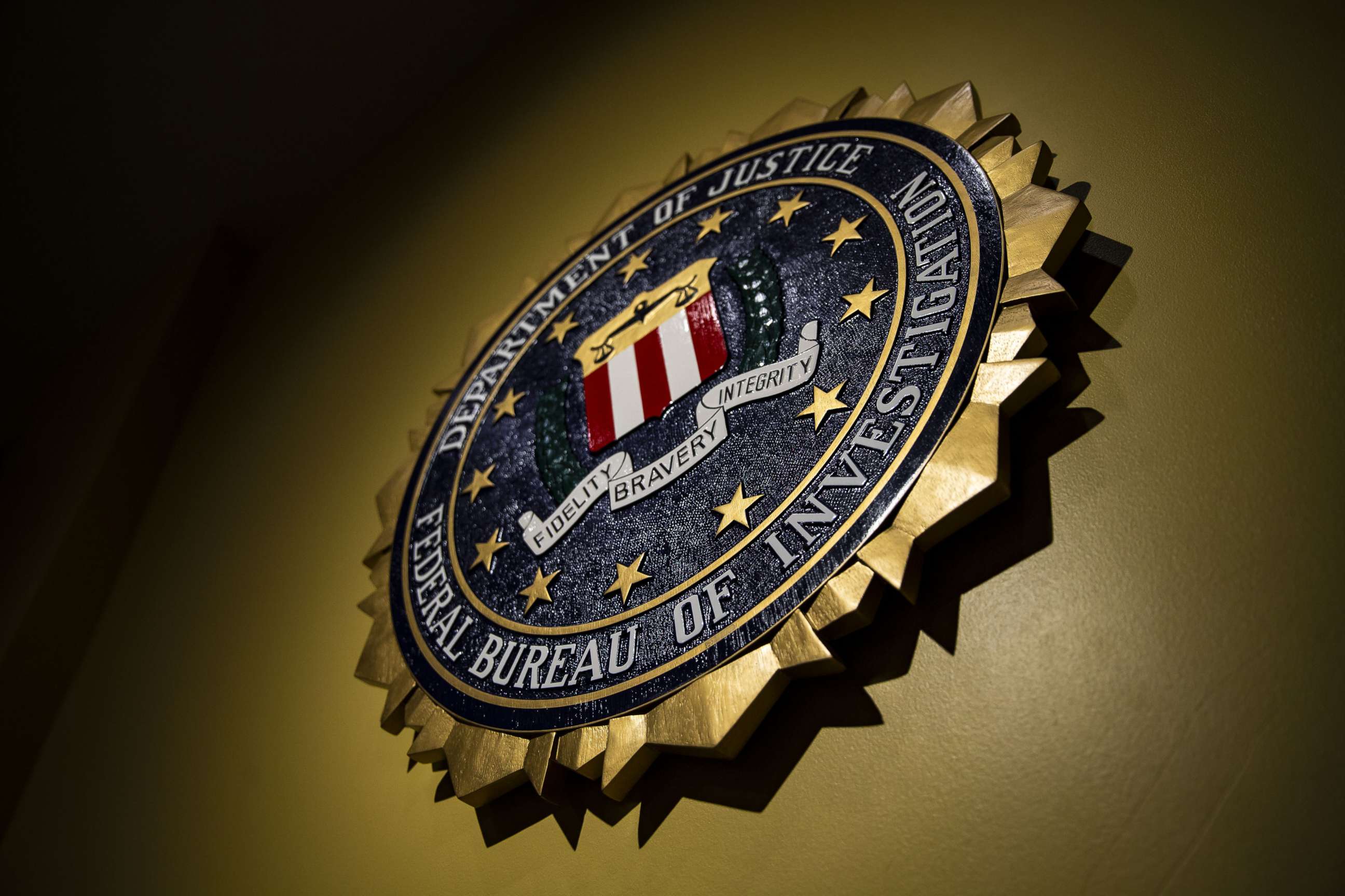 PHOTO: The seal of the Federal Bureau of Investigation (FBI) hangs on a wall at the FBI headquarters in Washington, D.C., June 14, 2018.