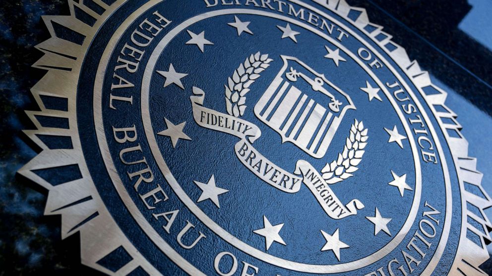 PHOTO: A seal reading "Department of Justice Federal Bureau of Investigation" is displayed on the J. Edgar Hoover FBI building in Washington, DC, Aug. 9, 2022.