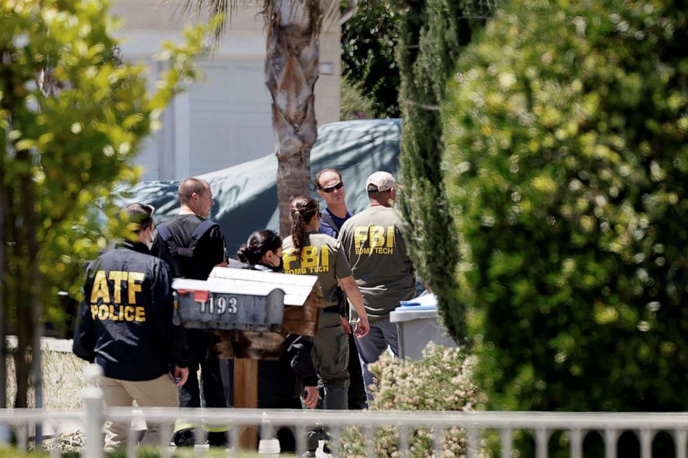 PHOTO: ATF and FBI agents approach the scene of the Santa Clara Valley Transportation Authority mass shooting suspect's house, after a fire at the home of the suspect erupted at about the same time as the shooting, in San Jose, Calif., May 26, 2021.