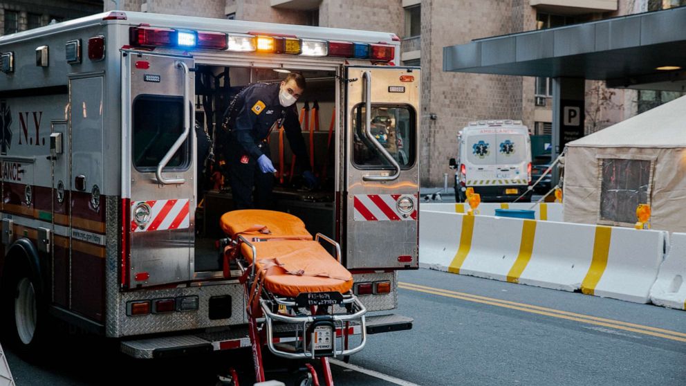 PHOTO: An ambulance is cleaned after transporting a patient to New York Presbyterian Lower Manhattan Hospital in New York, March 26, 2020.