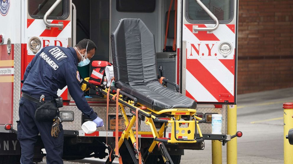PHOTO: An FDNY paramedic disinfects the ambulance equipment after bringing a patient to Wyckoff Hospital in the Bushwick section of Brooklyn, April 5, 2020, in New York.
