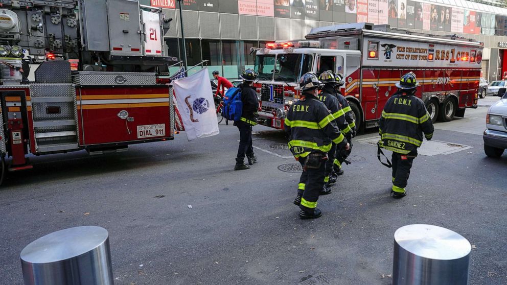 PHOTO: Members of FDNY exit a building while on a call in New York City, Nov. 14, 2020.