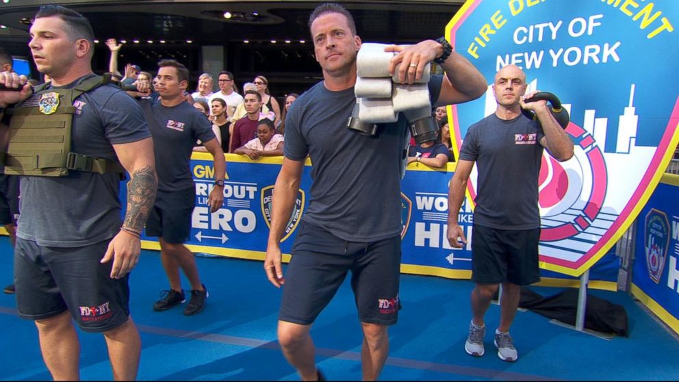 PHOTO: Members of the Fire Department of the City of New York (FDNY) demonstrate workout moves they use to stay in life-saving shape.