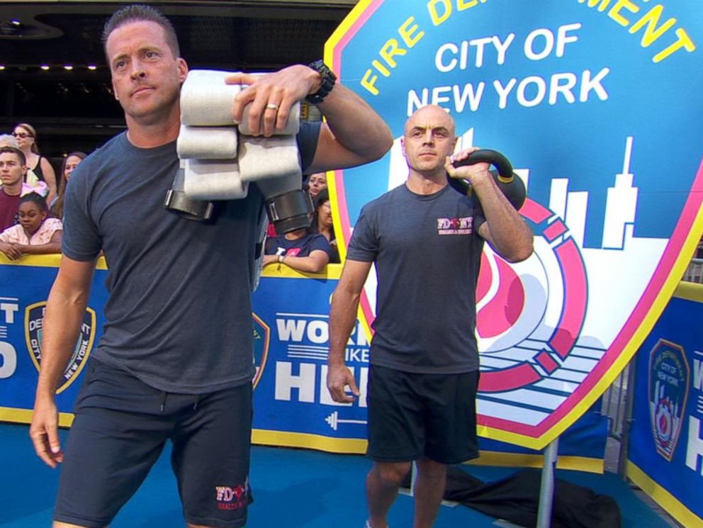 PHOTO: Members of the Fire Department of the City of New York (FDNY) demonstrate workout moves they use to stay in life-saving shape.