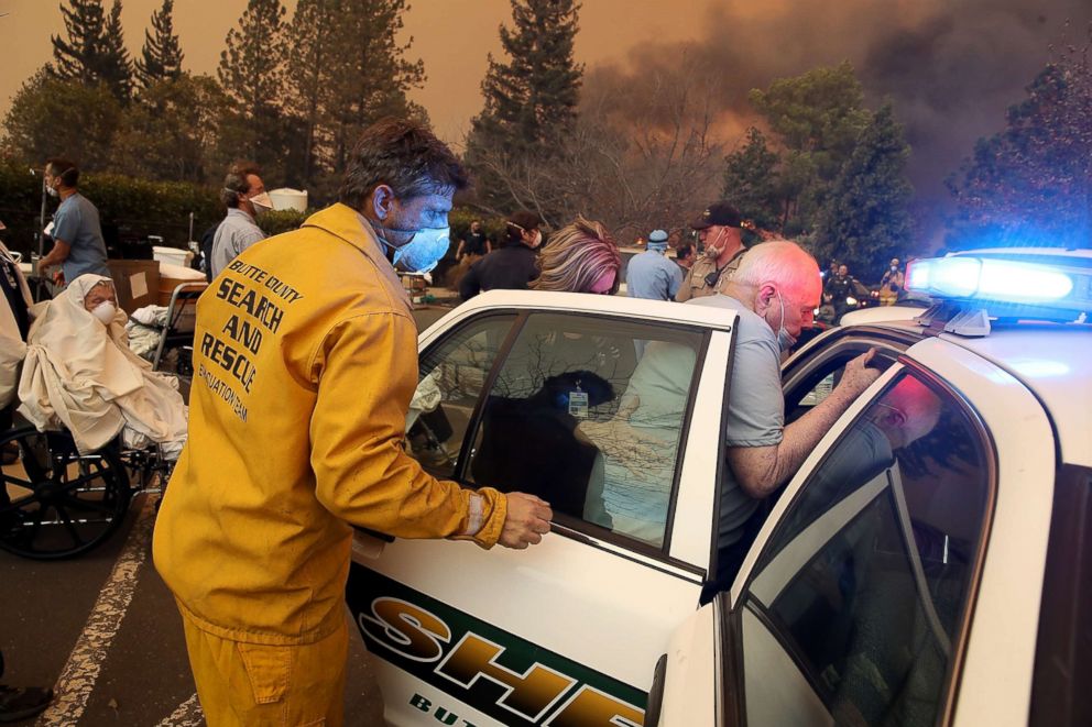  Hospital workers and first responders evacuate patients from the Feather River Hospital as the Camp Fire moves through the area on Nov. 8, 2018 in Paradise, Calif. 