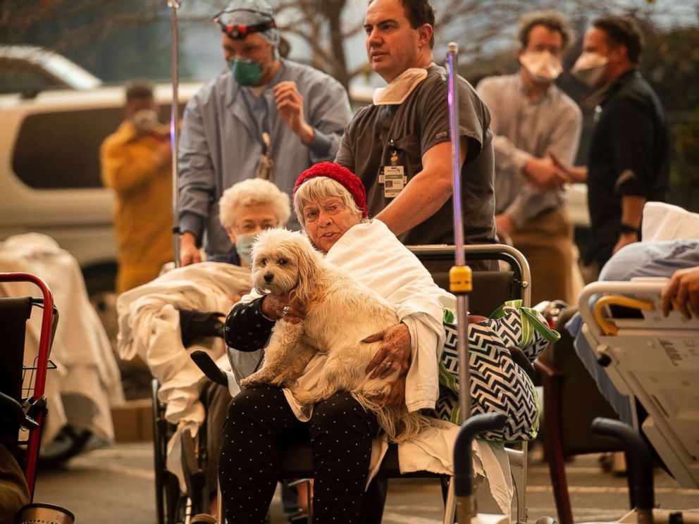 PHOTO: Medical personnel evacuate patients as the Feather River Hospital burns while the Camp Fire rages through Paradise, Calif., Nov. 8, 2018.