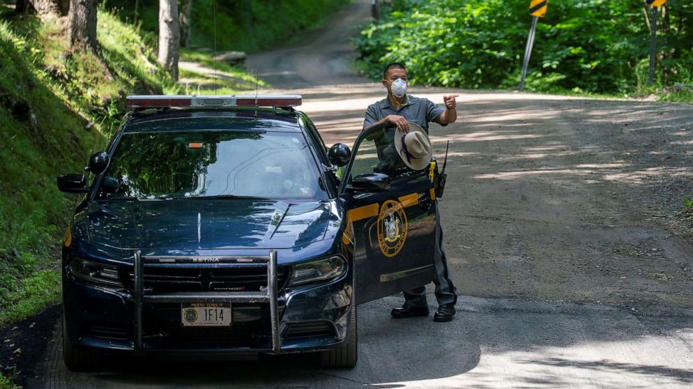 PHOTO: A New York State Trooper stands guard outside the home of attorney Roy Den Hollander, who was found dead after allegedly killing the son of federal judge Esther Salas and wounding her husband, in Catskills, N.Y., July 20, 2020.
