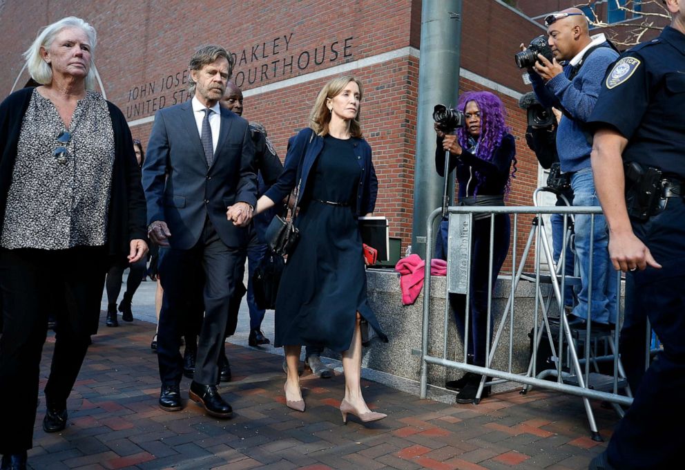 PHOTO: Felicity Huffman leaves federal court with her husband William H. Macy after she was sentenced in a nationwide college admissions bribery scandal, Friday, Sept. 13, 2019, in Boston.