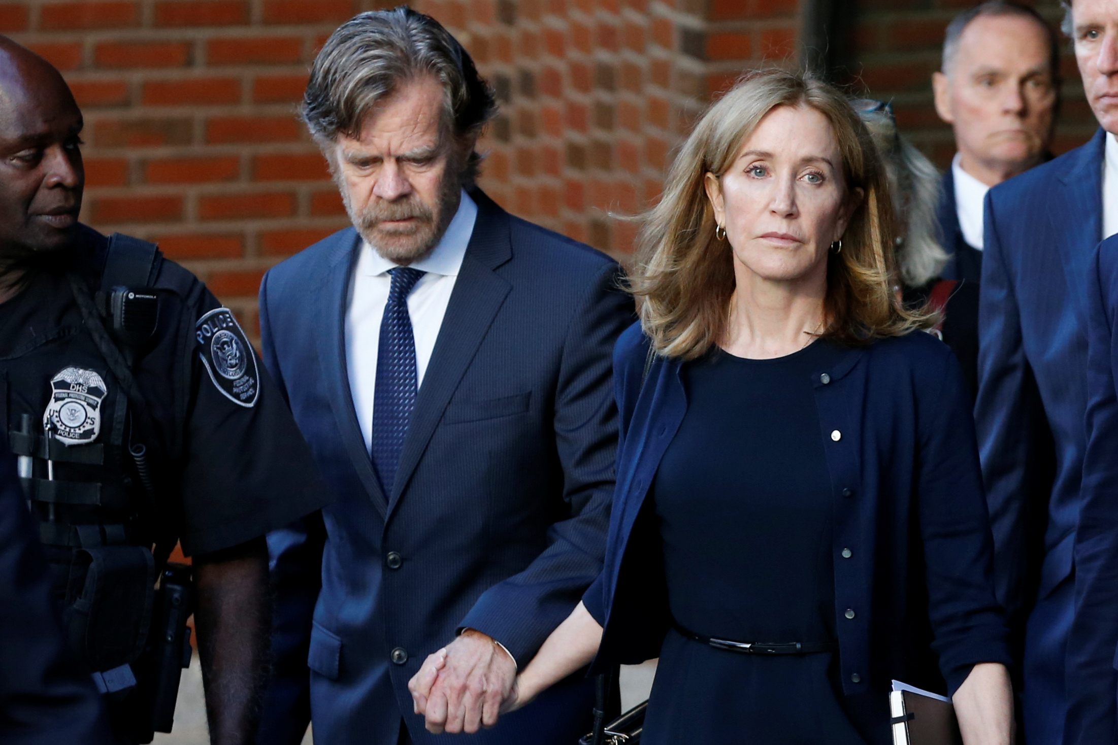 PHOTO: Actress Felicity Huffman leaves the federal courthouse with her husband William H. Macy, after being sentenced in connection with a nationwide college admissions cheating scheme in Boston, Mass., September 13, 2019.
