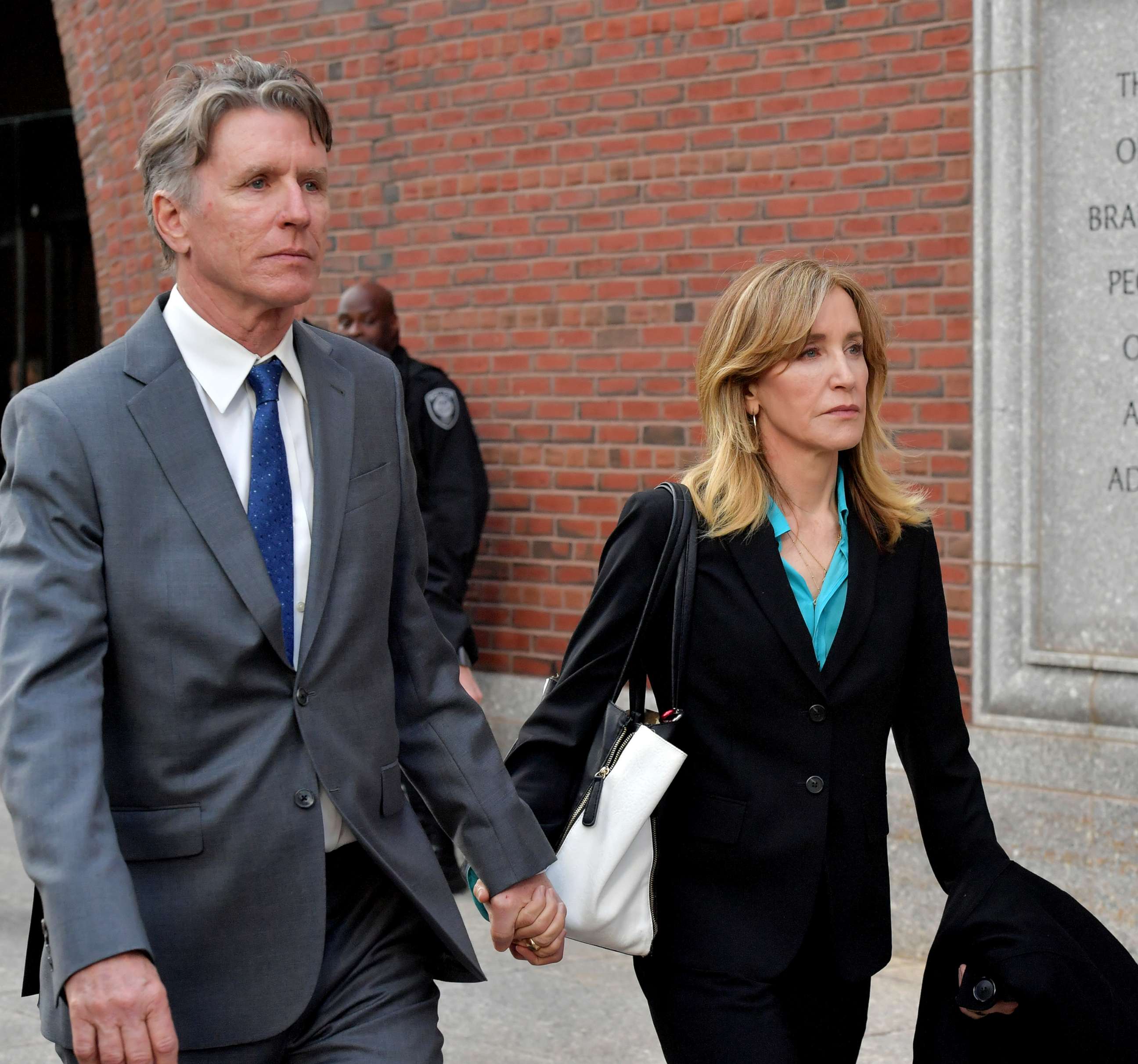 PHOTO:Felicity Huffman exits the John Joseph Moakley U.S. Courthouse after appearing in Federal Court to answer charges stemming from college admissions scandal, April 3, 2019,in Boston.