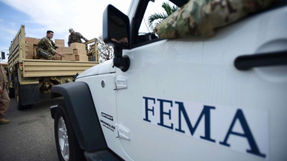 Department of Homeland Security personnel deliver supplies to Santa Ana community residents in the aftermath of Hurricane Maria in Guayama, Puerto Rico, Oct. 5, 2017.