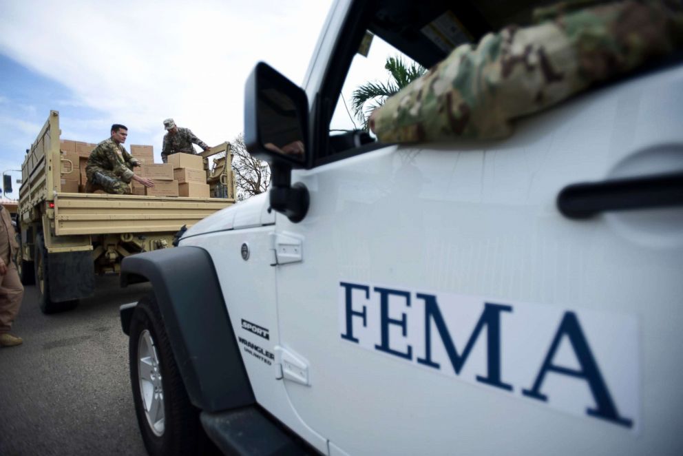 PHOTO: Department of Homeland Security personnel deliver supplies to Santa Ana community residents in the aftermath of Hurricane Maria in Guayama, Puerto Rico, Oct. 5, 2017. 