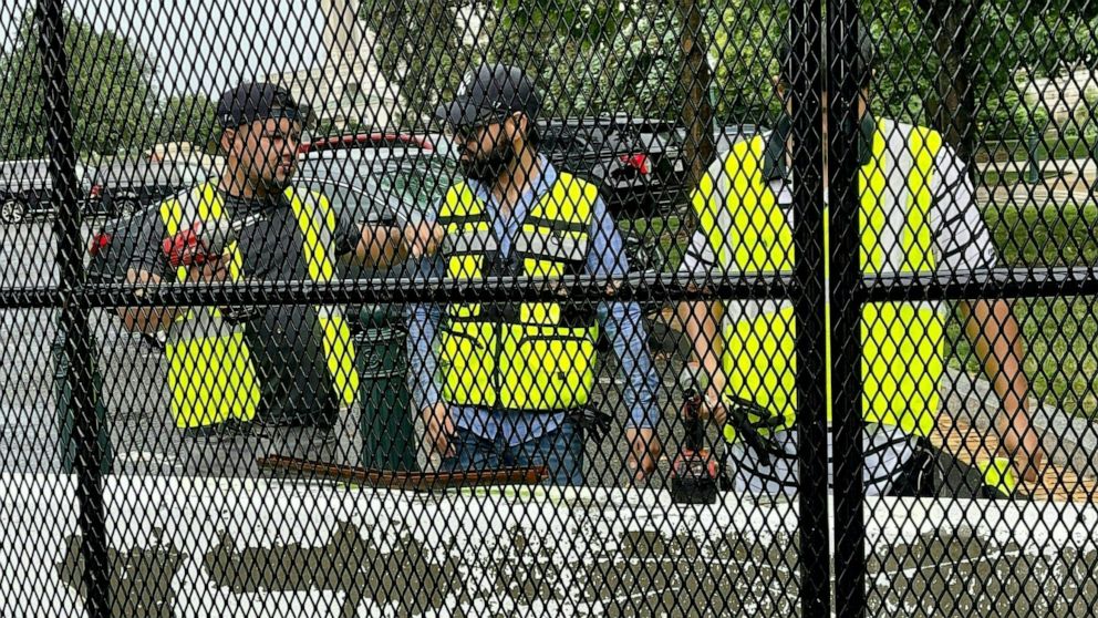 PHOTO: Workers prepare to dismantle fences around the Capitol, July 9, 2021.
