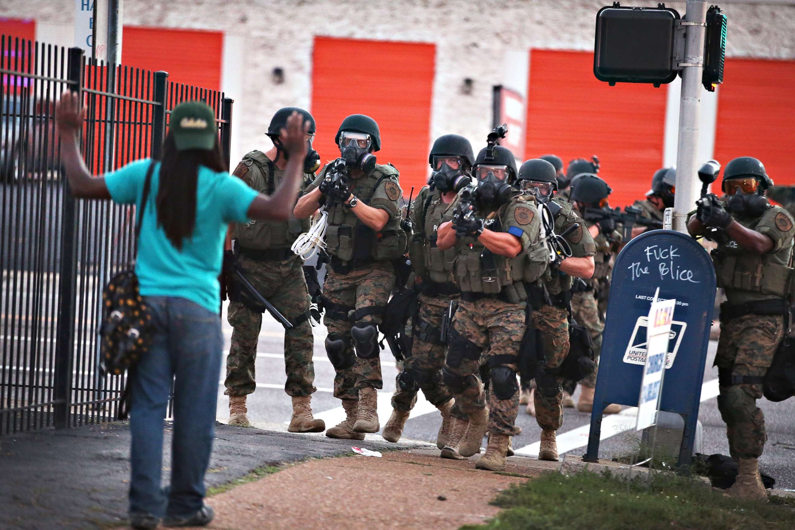 PHOTO: Police force protestors from the business district into nearby neighborhoods, on Aug. 11, 2014, in Ferguson, Missouri.