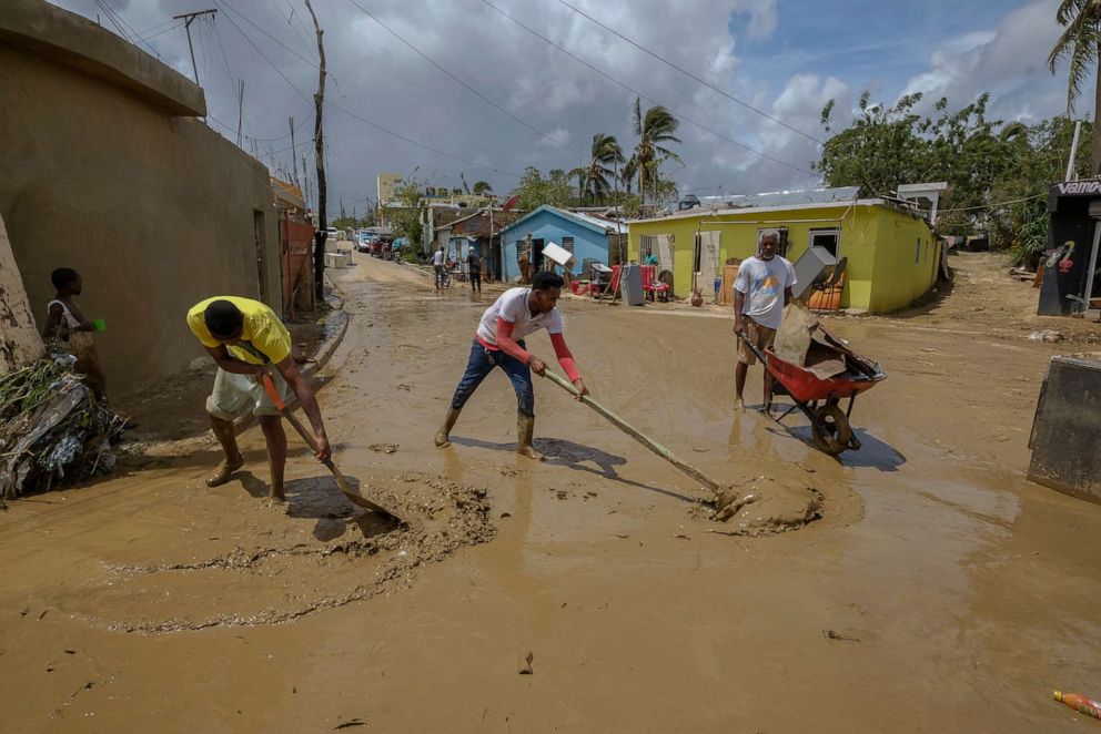 PHOTO: Locals clear mud brought by Hurricane Fiona in the Los Sotos neighborhood of Higuey, Dominican Republic, Tuesday, Sept. 20, 2022.