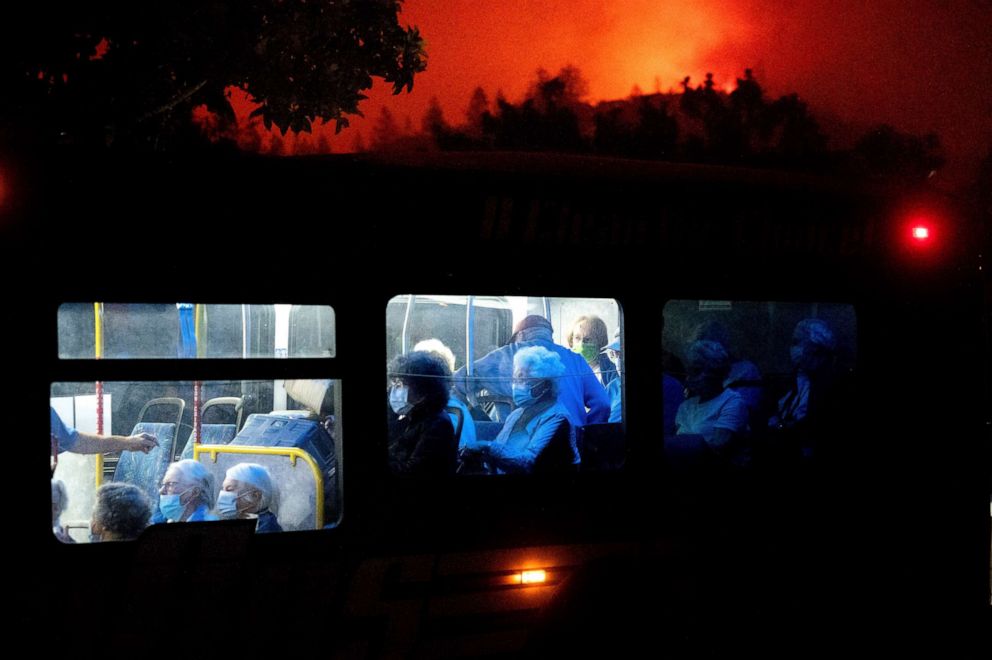 PHOTO: Residents of the Oakmont Gardens senior home evacuate on a bus as the Shady Fire approaches in Santa Rosa, Calif., Sept. 28, 2020. 
