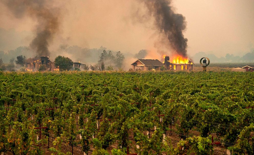 PHOTO: A building is engulfed in flames at a vineyard during the Kincade fire near Geyserville, California on October 24, 2019.