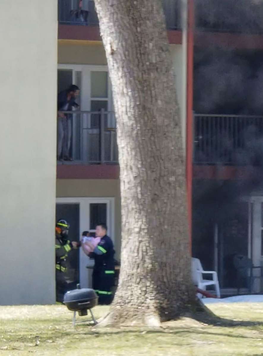 PHOTO: A baby was dropped from a second-floor balcony after a fire broke out at an apartment complex, April 22, 2018, in St. Paul, Minn. 