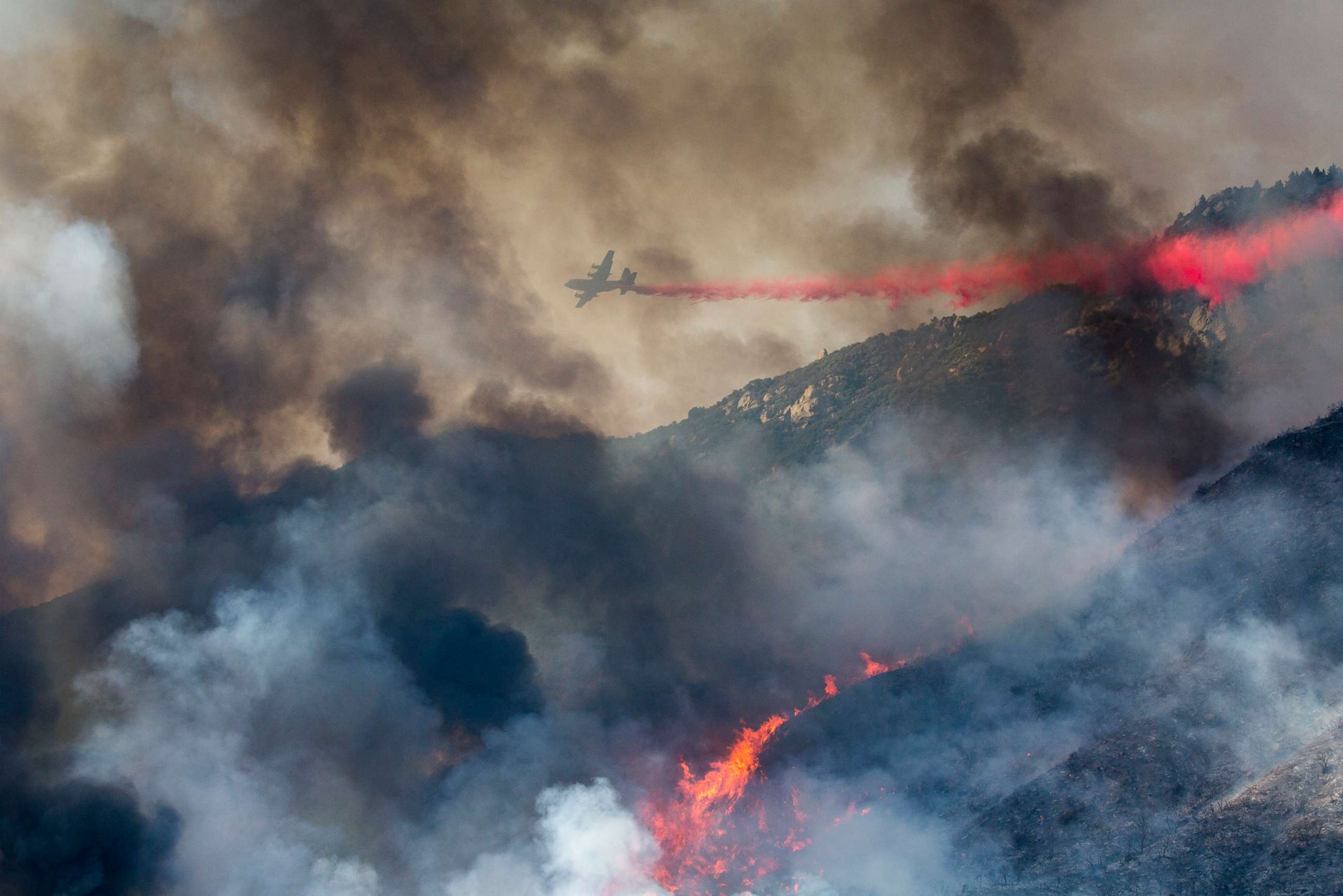 PHOTO: An air tanker drops retardant at a wildfire burns at a hillside in Yucaipa, Calif., Sept. 5, 2020. 