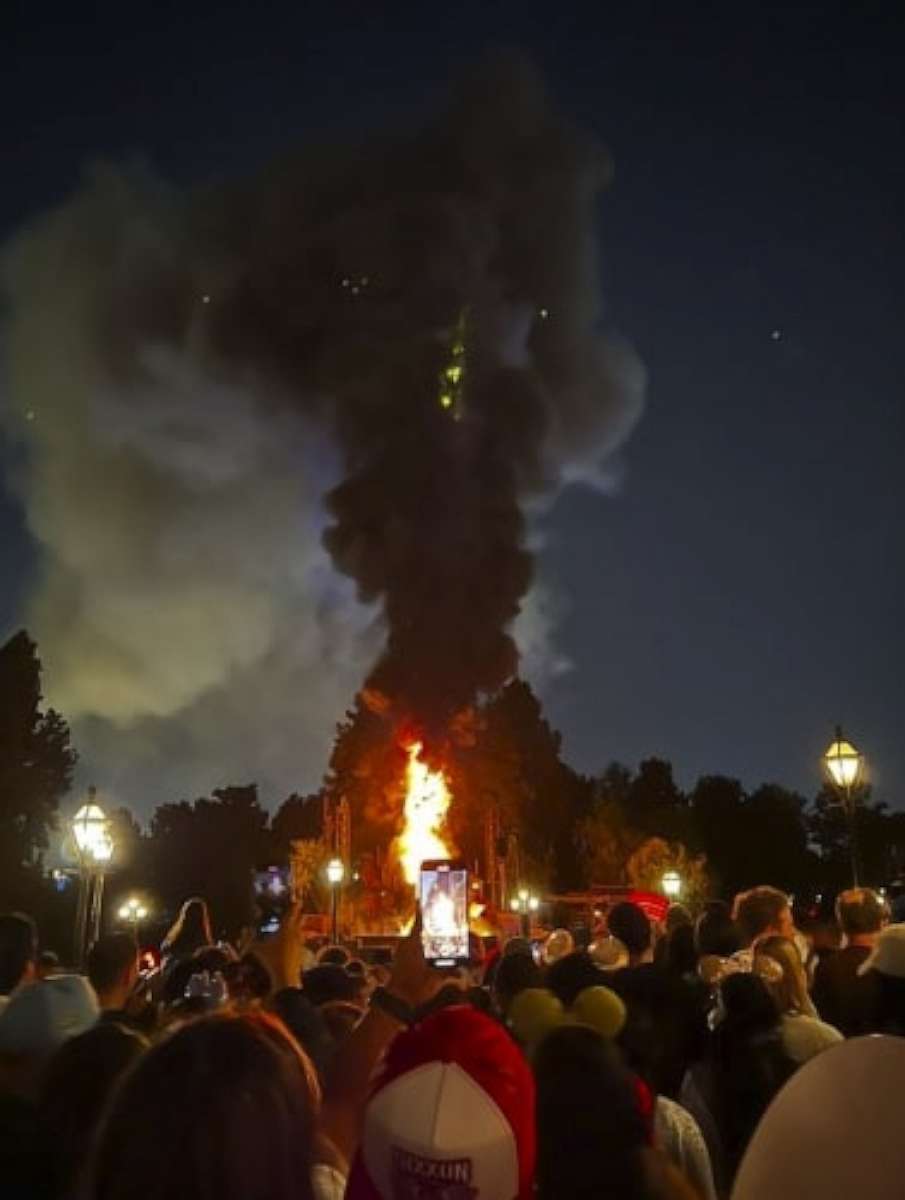 PHOTO: An image captured by an attendee shows Tom Sawyer Island as an animatronic dragon catches fire during a showing of Fantasmic! at Disneyland in Anaheim, California, April 22, 2023.