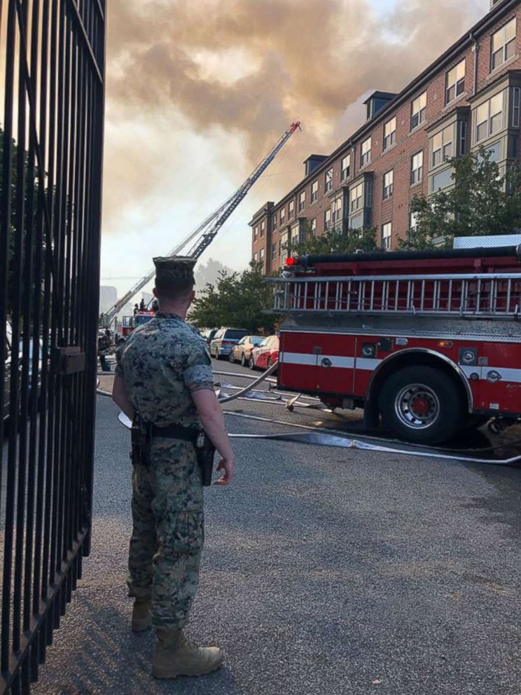 PHOTO: U.S. Marines assist firefighters with saving senior citizens from a burning building in Washington, D.C, Sept. 19, 2018.