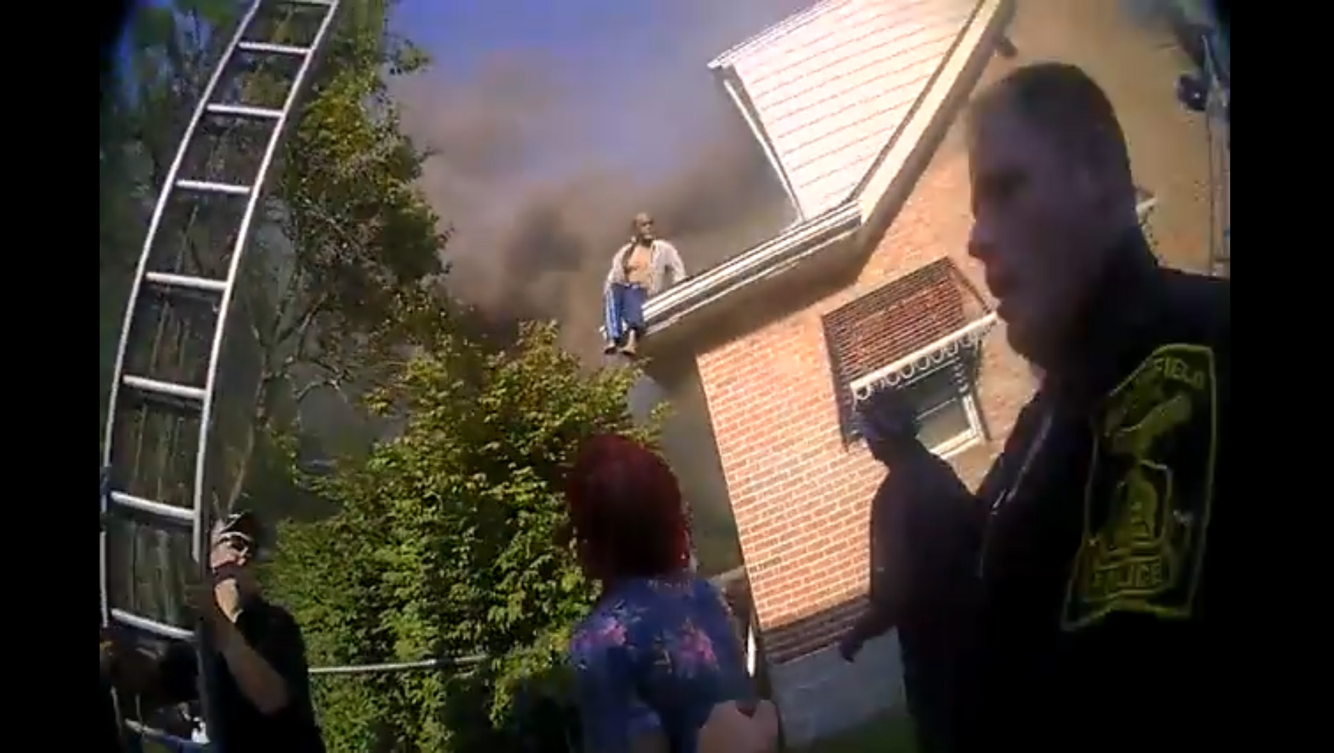 PHOTO: Bodycam video released by police in Bloomfield, Conn., shows officers and firefighters coming to the aid of people trying to escape from a burning home on July 31, 2018.