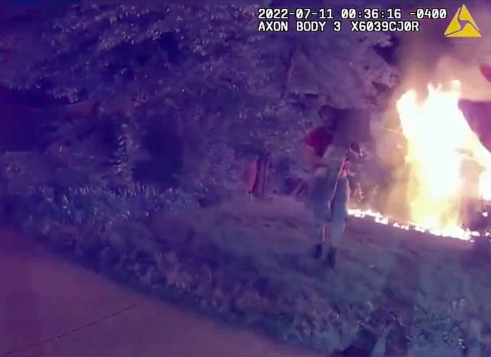 PHOTO: Bodycam video shows Nicholas Bostic carrying a child from a house fire in Lafayette, Ind., July 11, 2022.