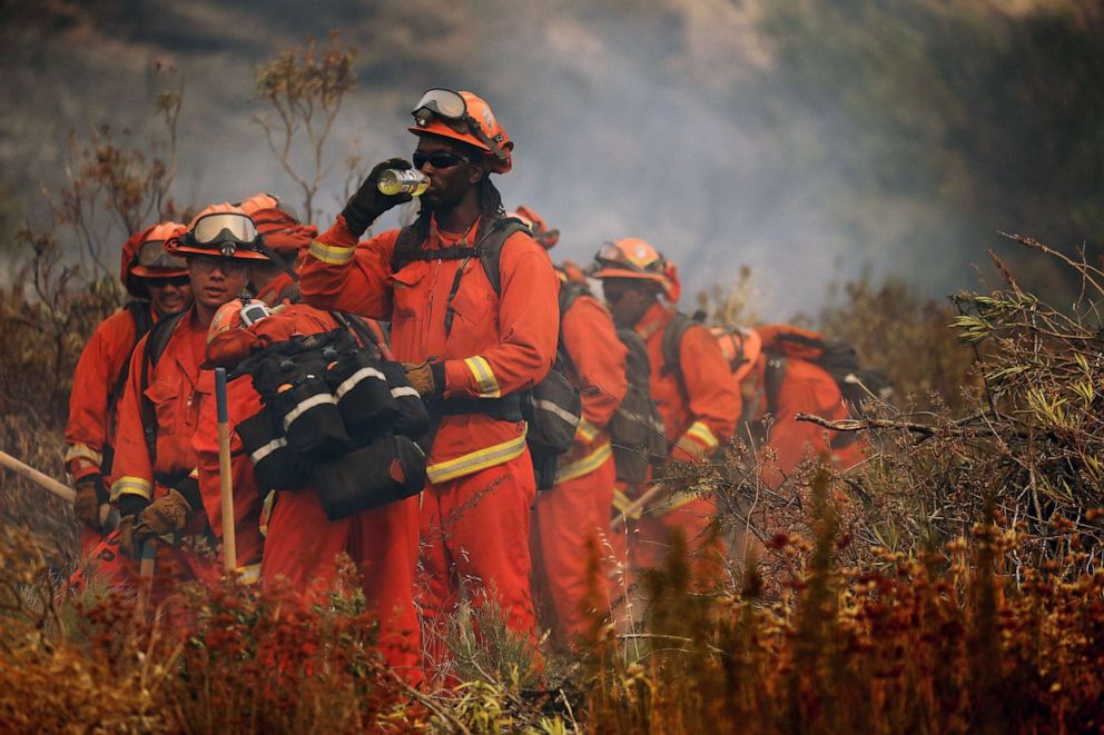 PHOTO:Firefighters work to extinguish the 'Apple Fire', near Beaumont, in Riverside County, Calif., Aug. 2, 2020.