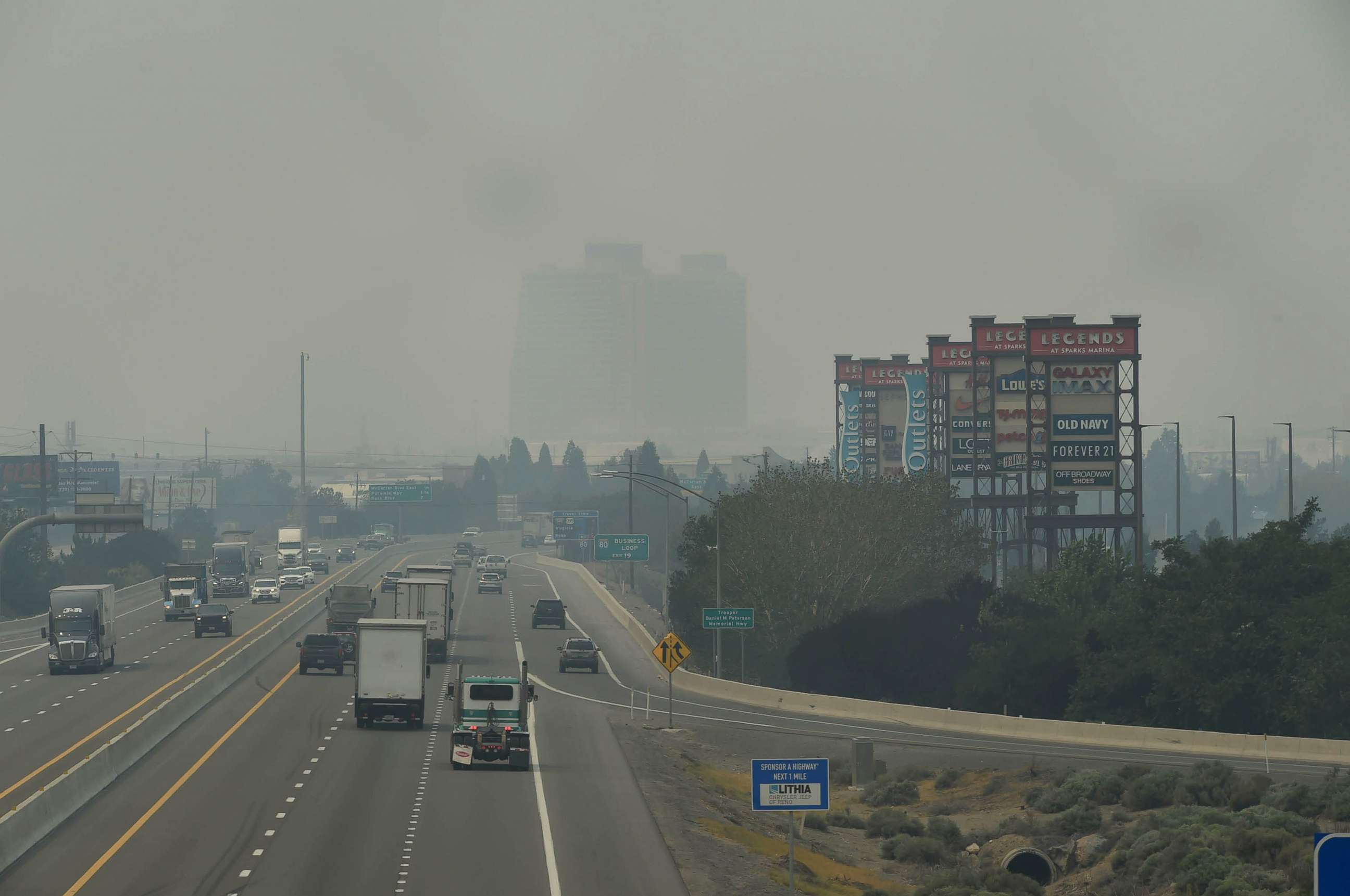 PHOTO: Smoke from the Dixie and Caldor fires in Northern California covers I-80 highway, as seen from the Sparks Boulevard overpass in the Truckee Meadows area near Reno, Nevada, Aug. 17, 2021.