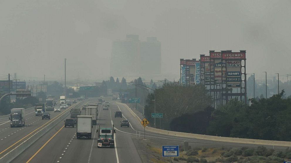 PHOTO: Smoke from the Dixie and Caldor fires in Northern California covers I-80 highway, as seen from the Sparks Boulevard overpass in the Truckee Meadows area near Reno, Nevada, Aug. 17, 2021.